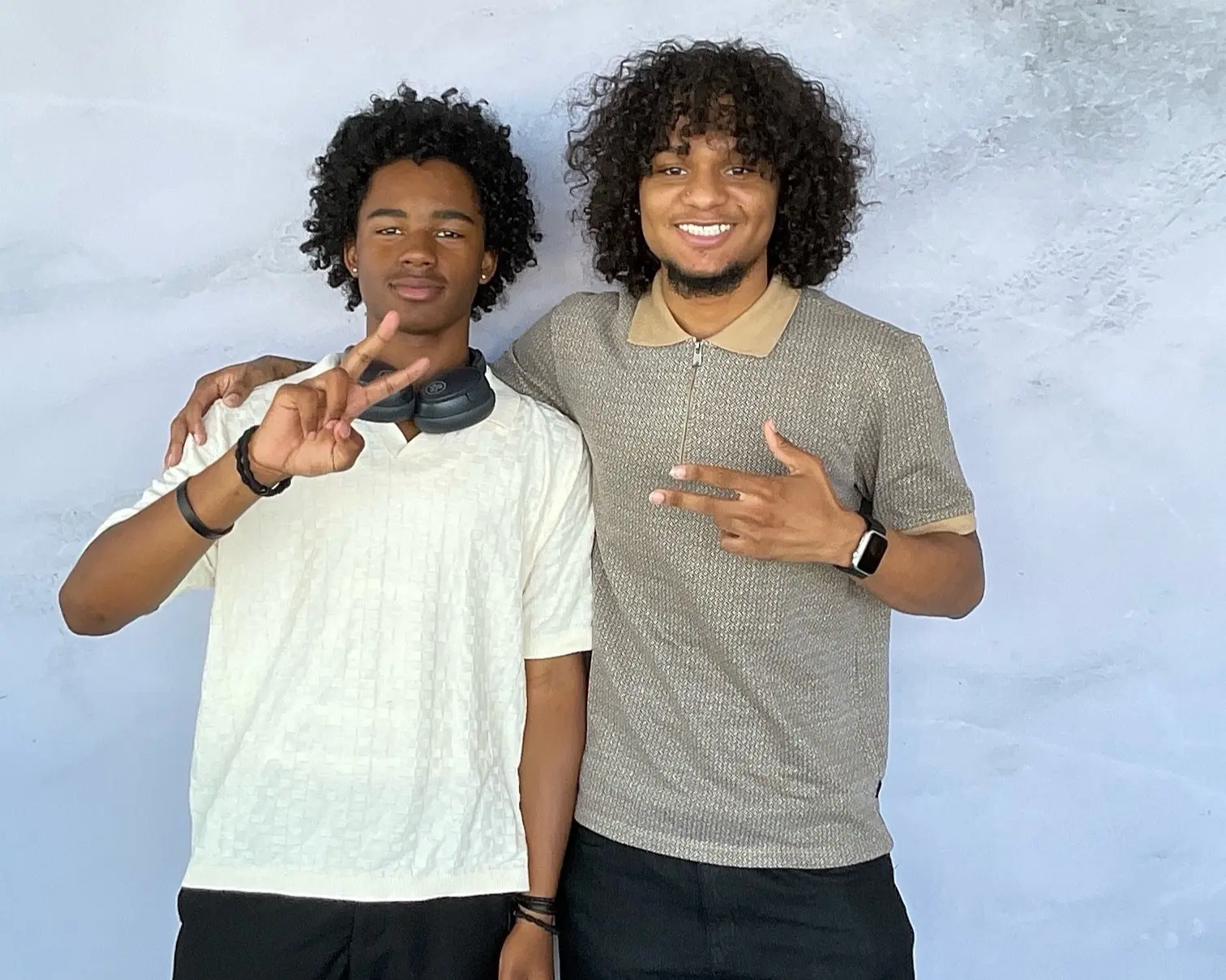 Two young men smiling together at N.J.'s 100th birthday celebration