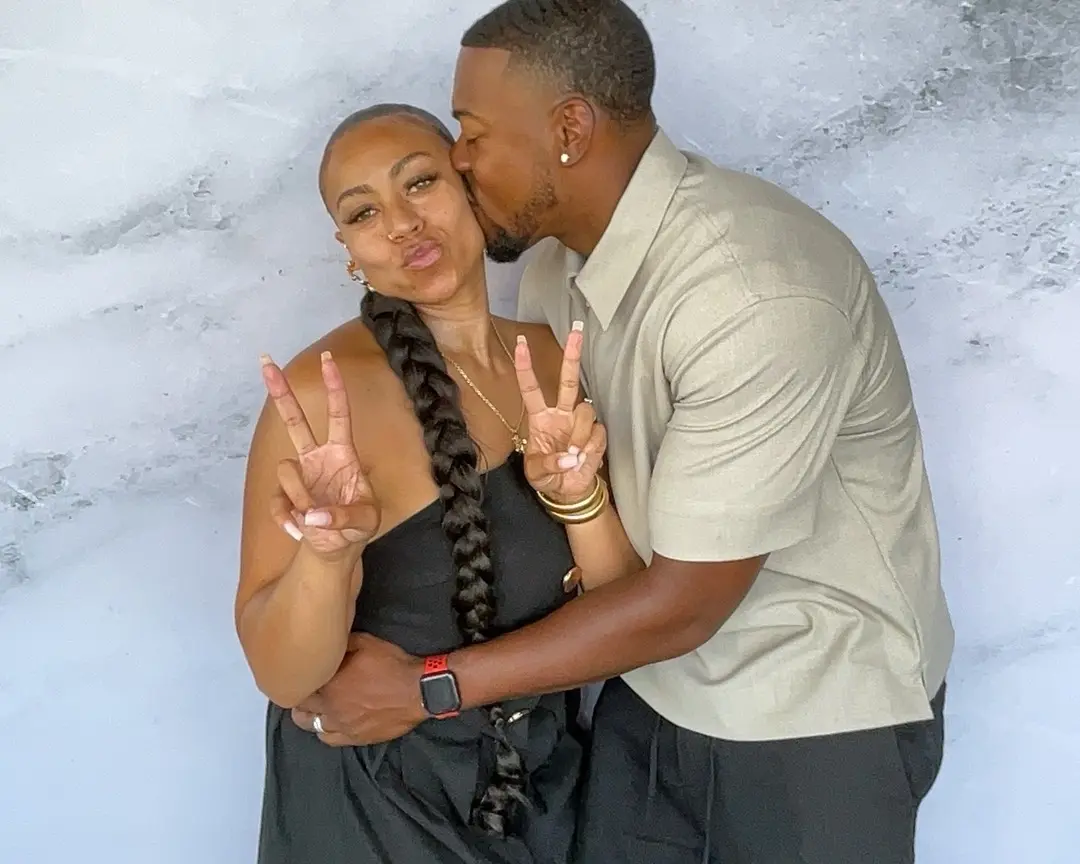 Couple sharing an affectionate photo booth moment