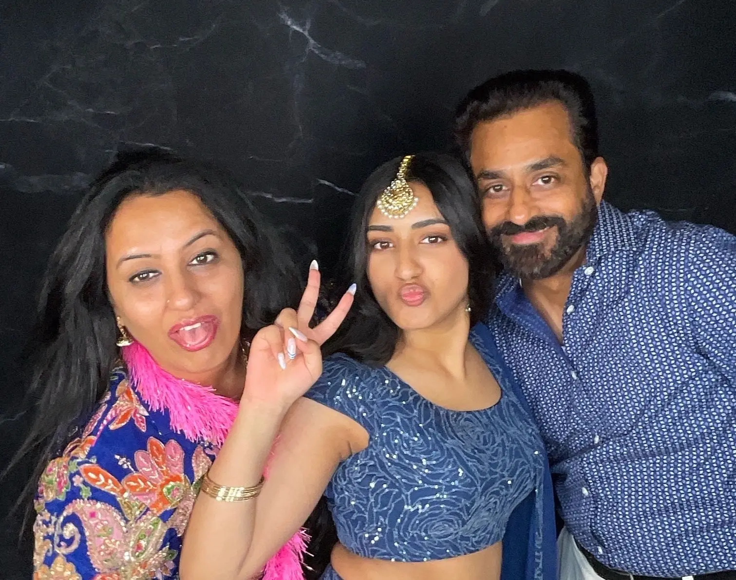 Family members having fun together in a photo booth