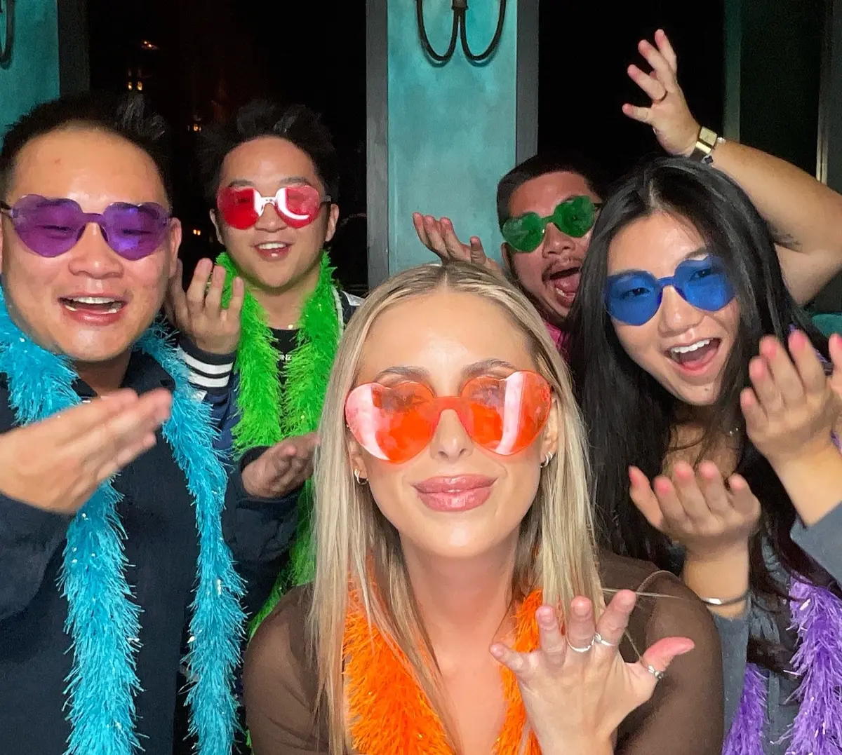 Friends celebrating a 30th birthday with colorful photo booth props, image 3