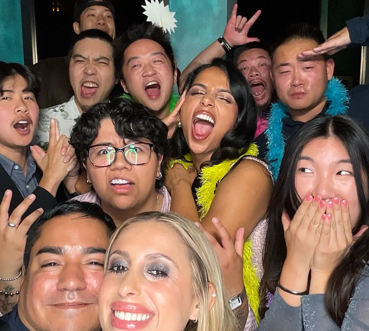 Friends celebrating a 30th birthday with colorful photo booth props, image 4