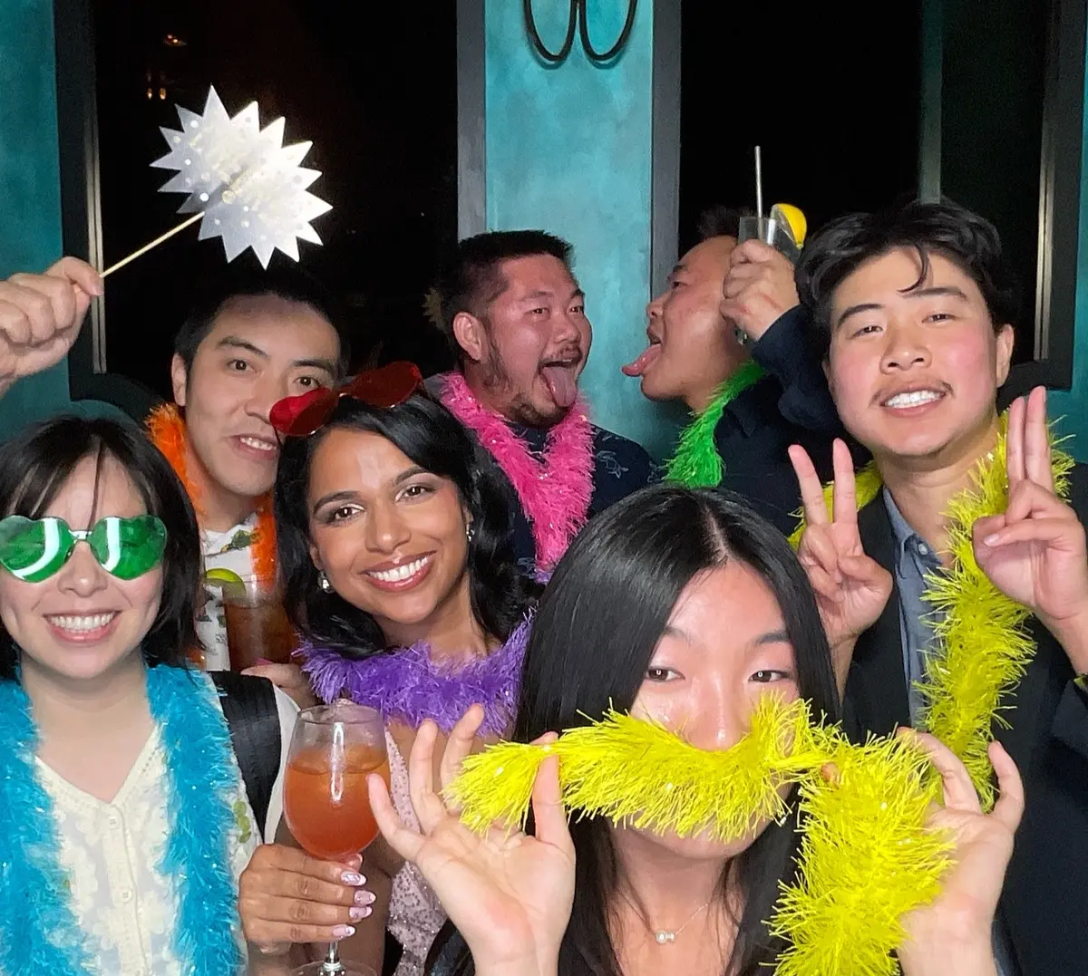 Friends celebrating a 30th birthday with colorful photo booth props, image 7