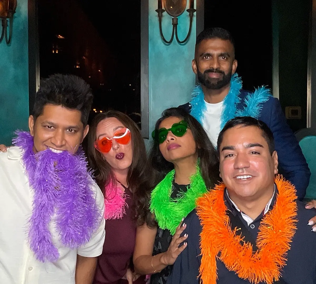 Friends celebrating a 30th birthday with colorful photo booth props, image 9