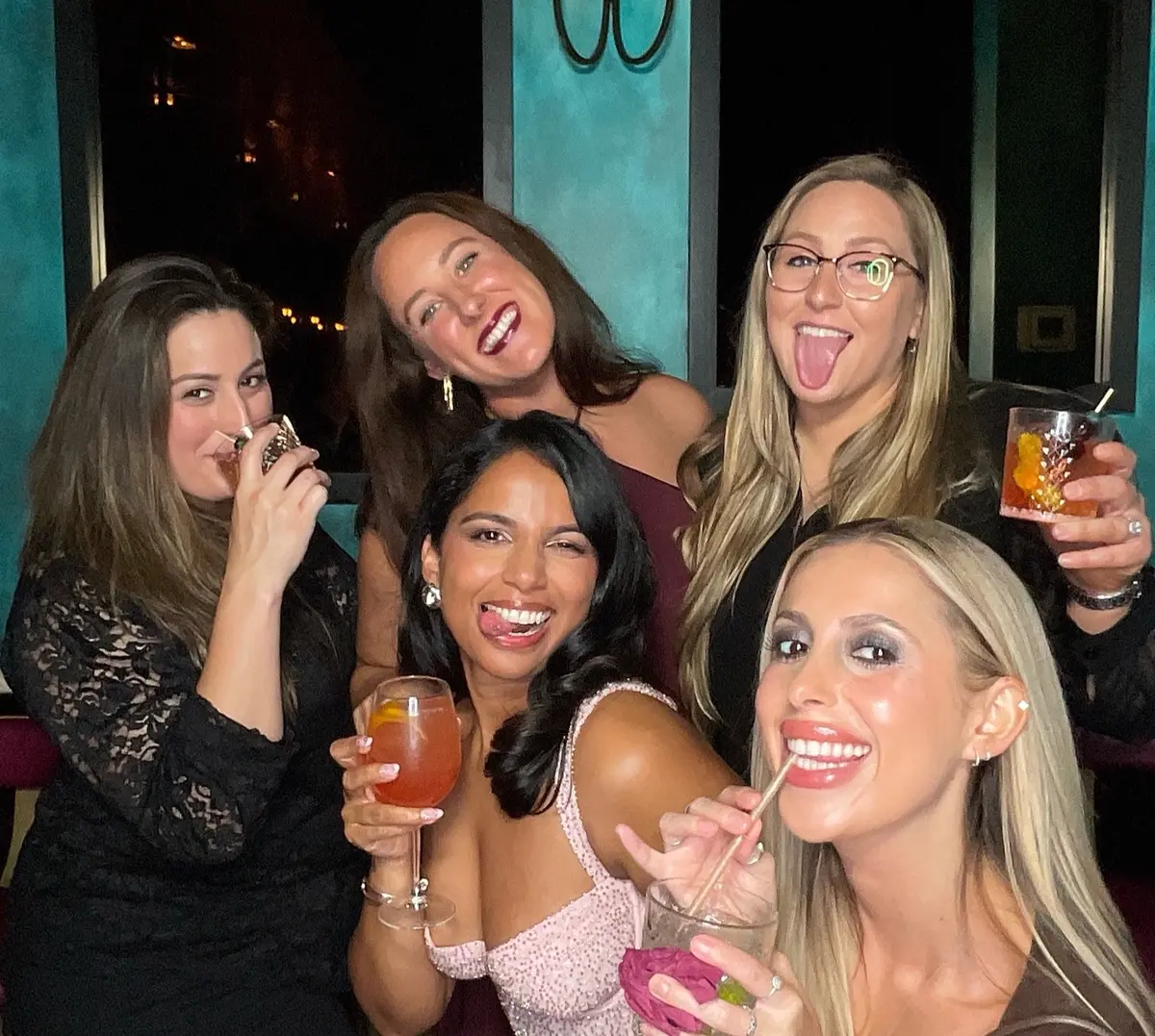 Friends celebrating a 30th birthday with colorful photo booth props, image 10