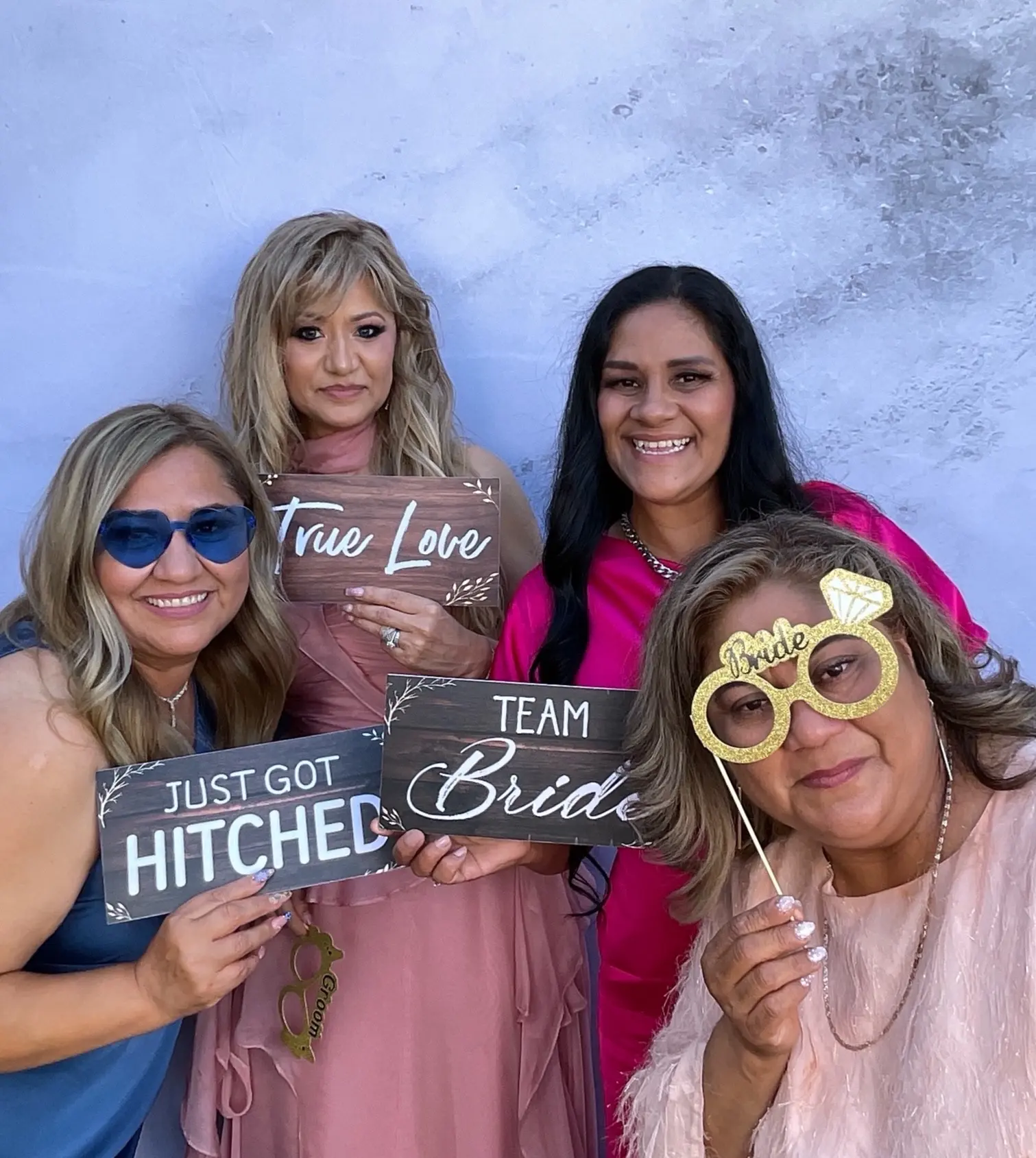 Wedding guests celebrating together in a photo booth