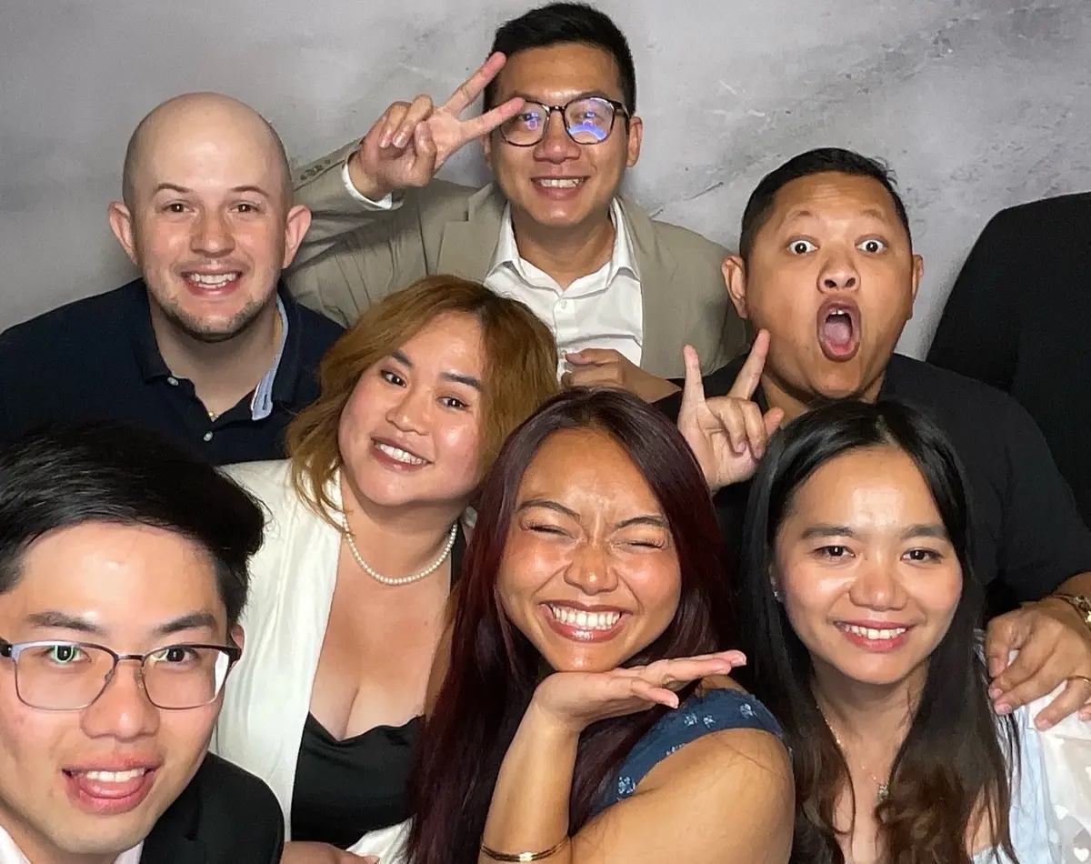 Wedding guests sharing a joyful photo booth moment at a Bay Area reception, image 3