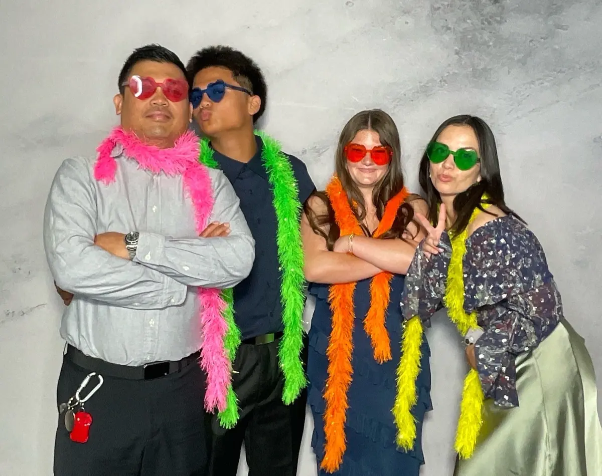 Wedding guests sharing a joyful photo booth moment at a Bay Area reception, image 15
