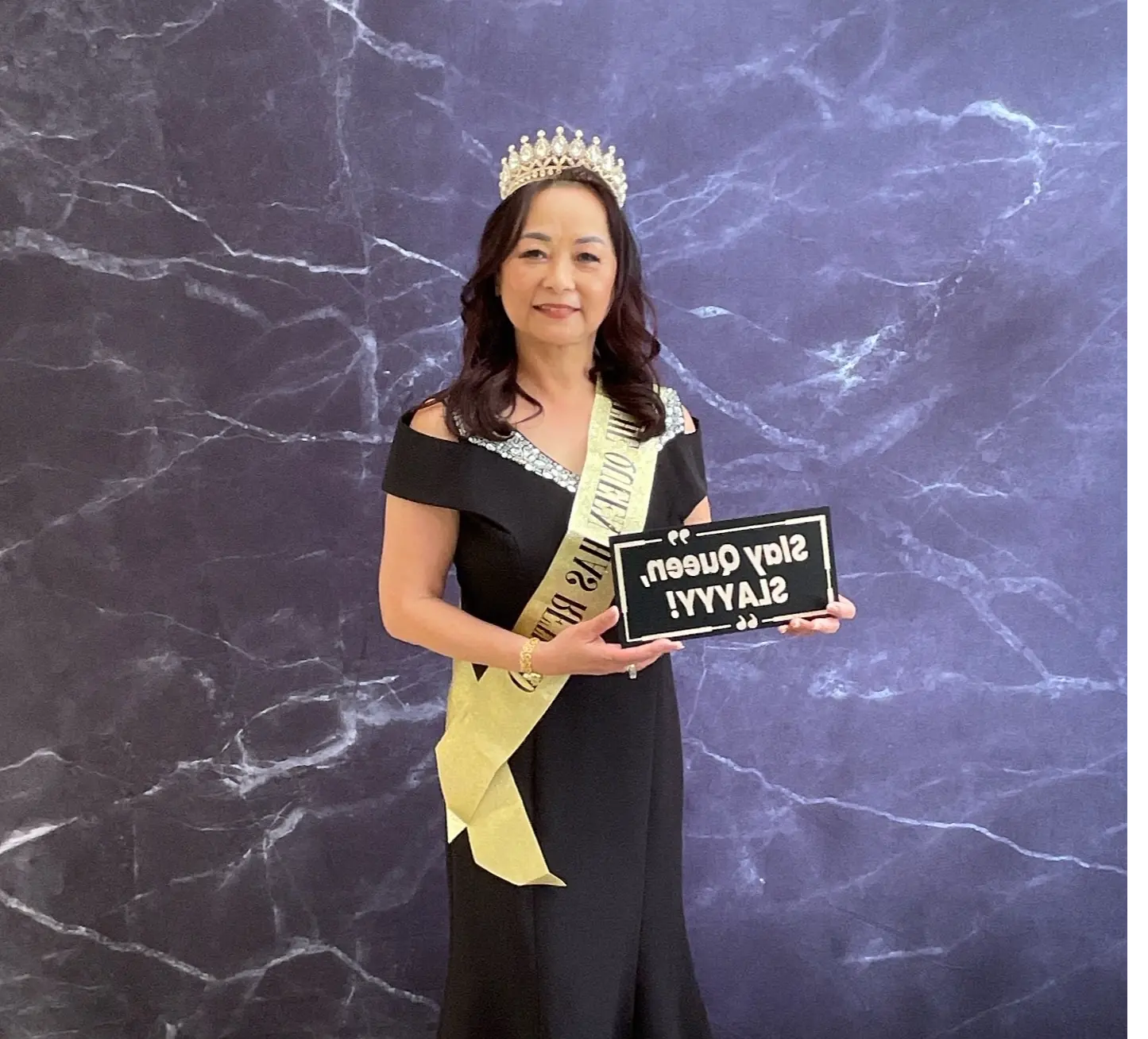 Retirement guest of honor wearing a crown and sash at Hilton Garden Inn in San Mateo