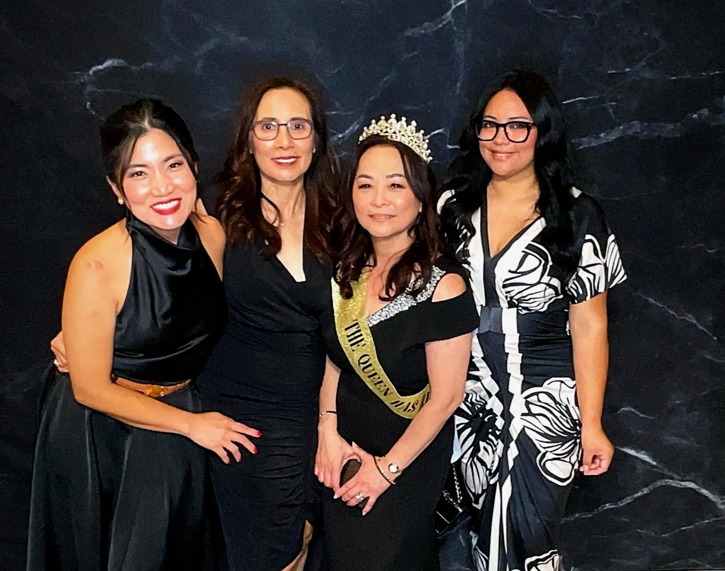 Retirement guest of honor posing with three friends in San Mateo