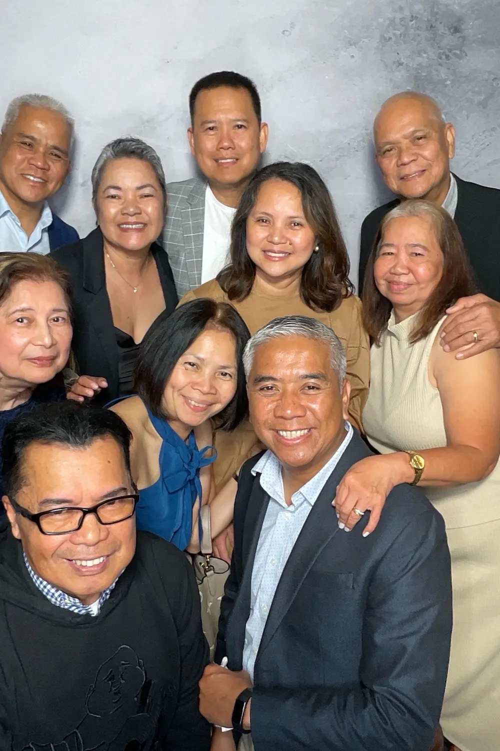 Multigenerational family gathering for a formal wedding portrait