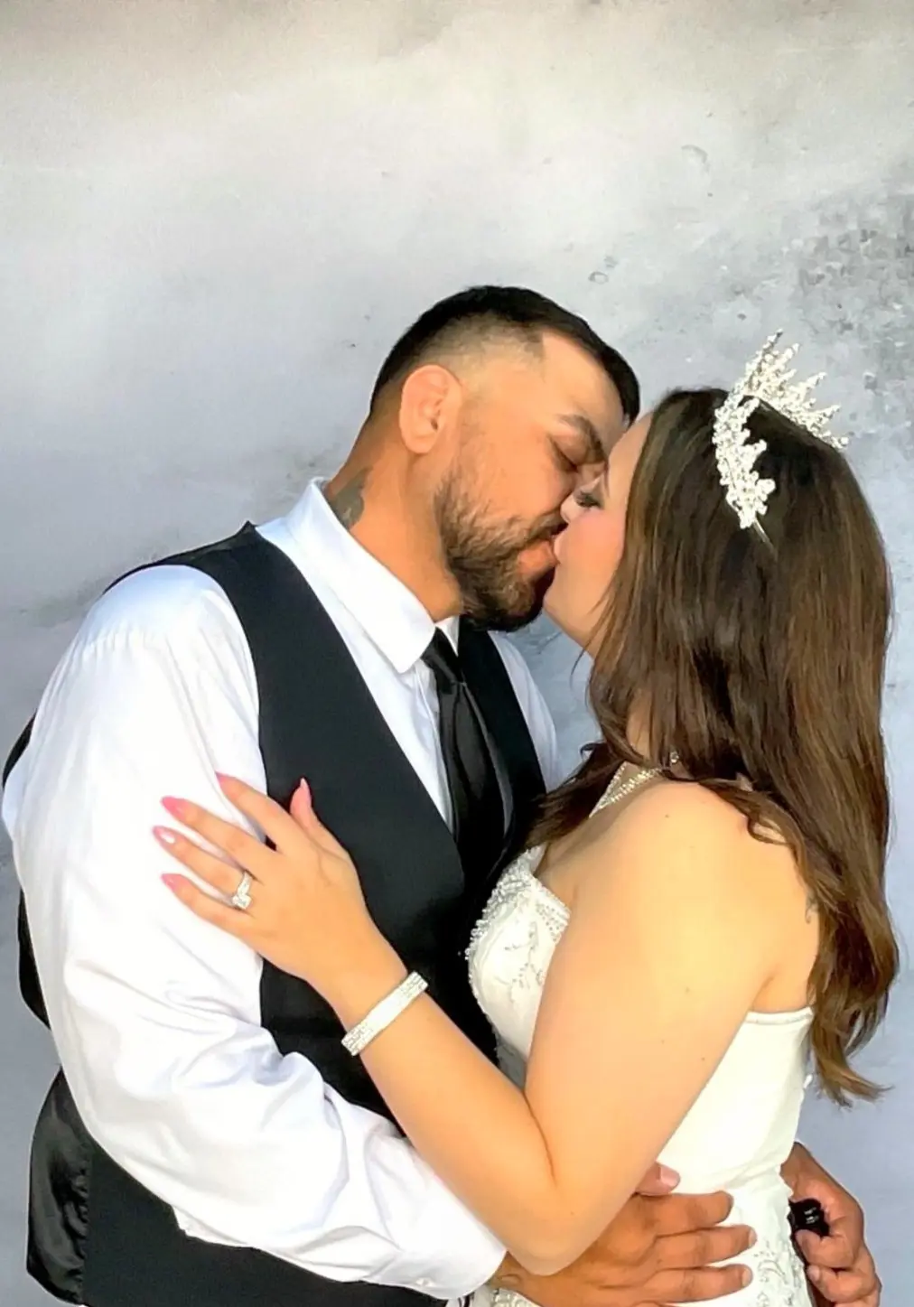 The newlyweds sharing a kiss in the photo booth
