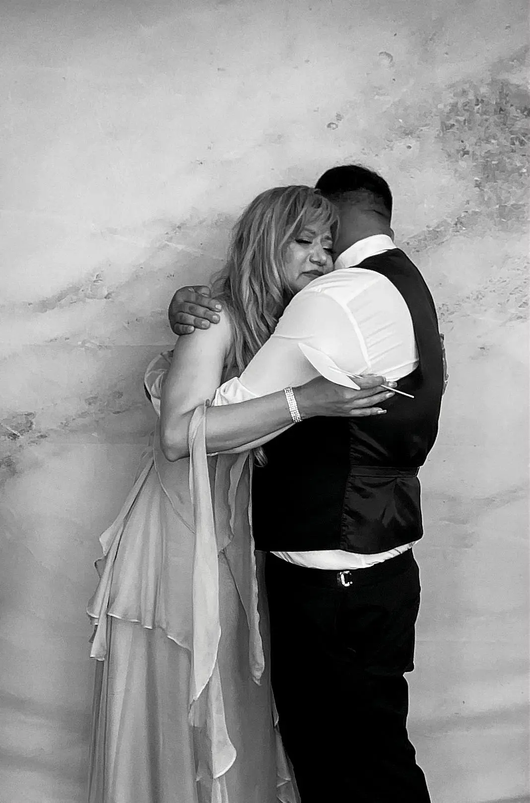 A tender embrace during the wedding reception