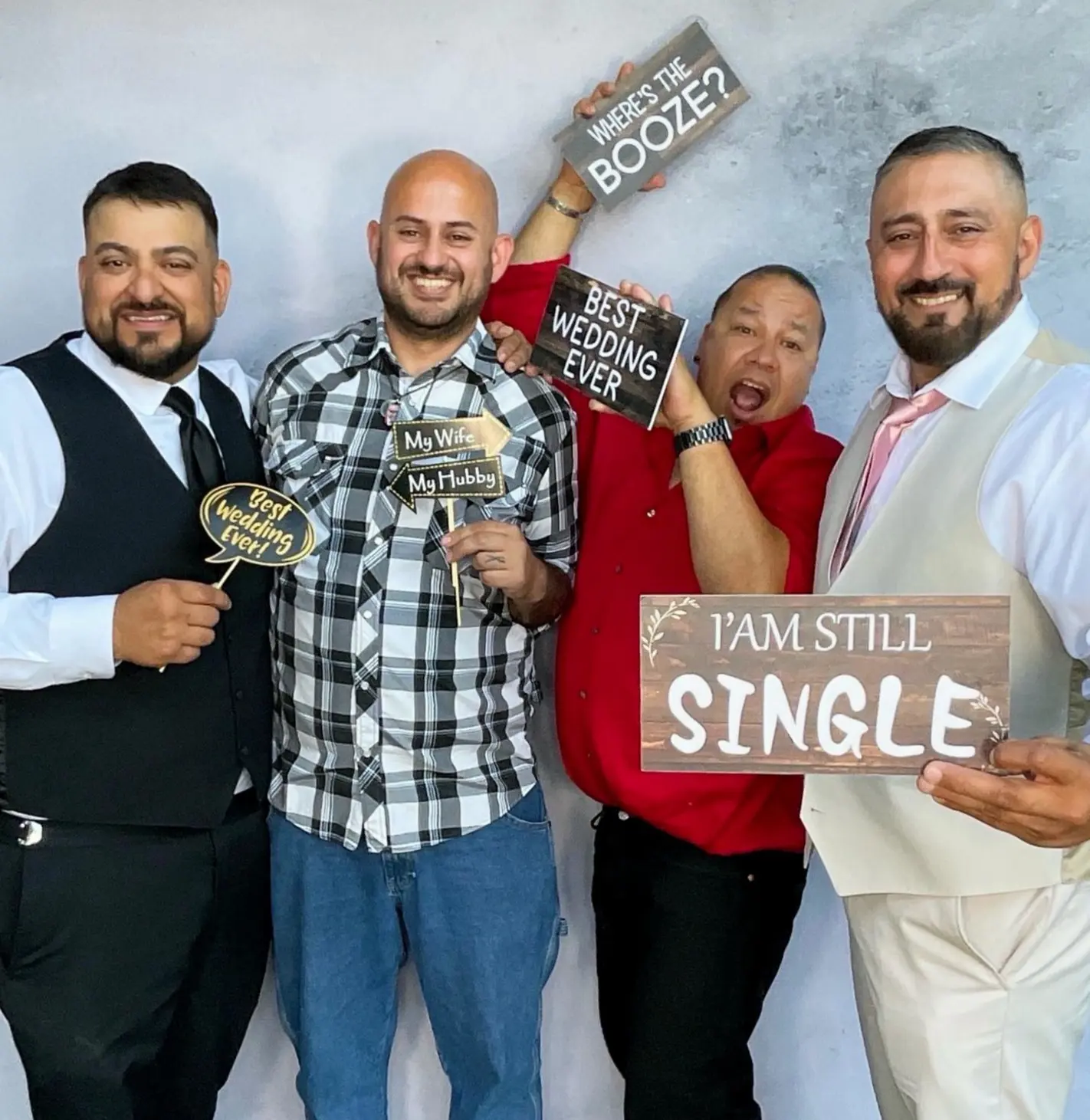 Wedding guests having fun with humorous signs